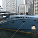 A member of the crew cleans the bow of the PHI superyacht, impounded by a unit of Britain’s National Crime Agency